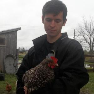 archie the writer holding a hen